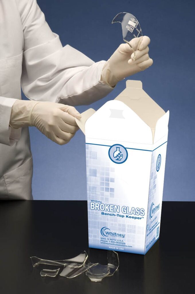 A person in white gloves holding onto a box