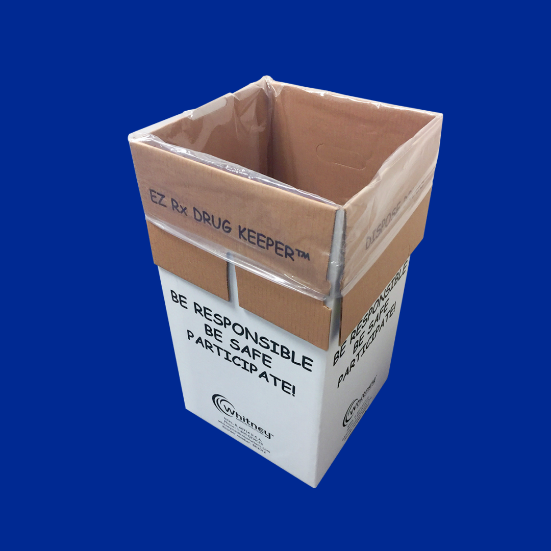 A cardboard box with a white lid and blue background