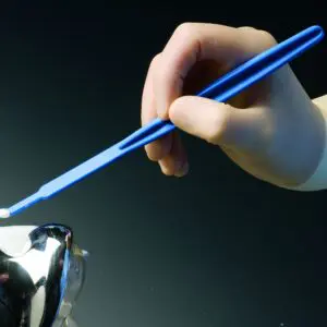 A person holding a pair of blue chopsticks.